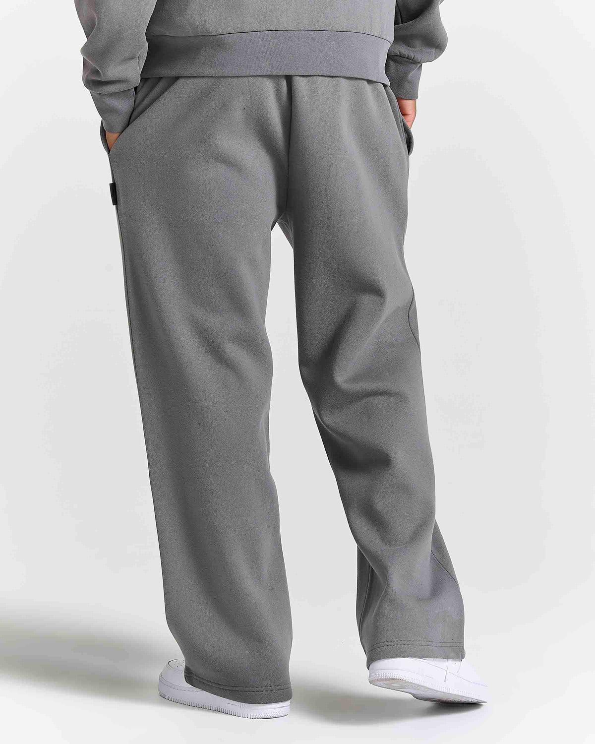 Displays a model wearing the Grey 'Hoodrich' branded men's Forza Full Tracksuit