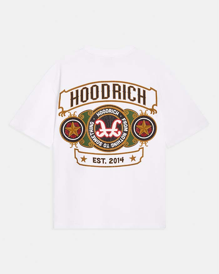 A white short-sleeve t-shirt with a large graphic print on the front. The graphic features the word 'HOODRICH' in a banner above a circular emblem with the brand's logo, flanked by two star circles, and 'EST 2014