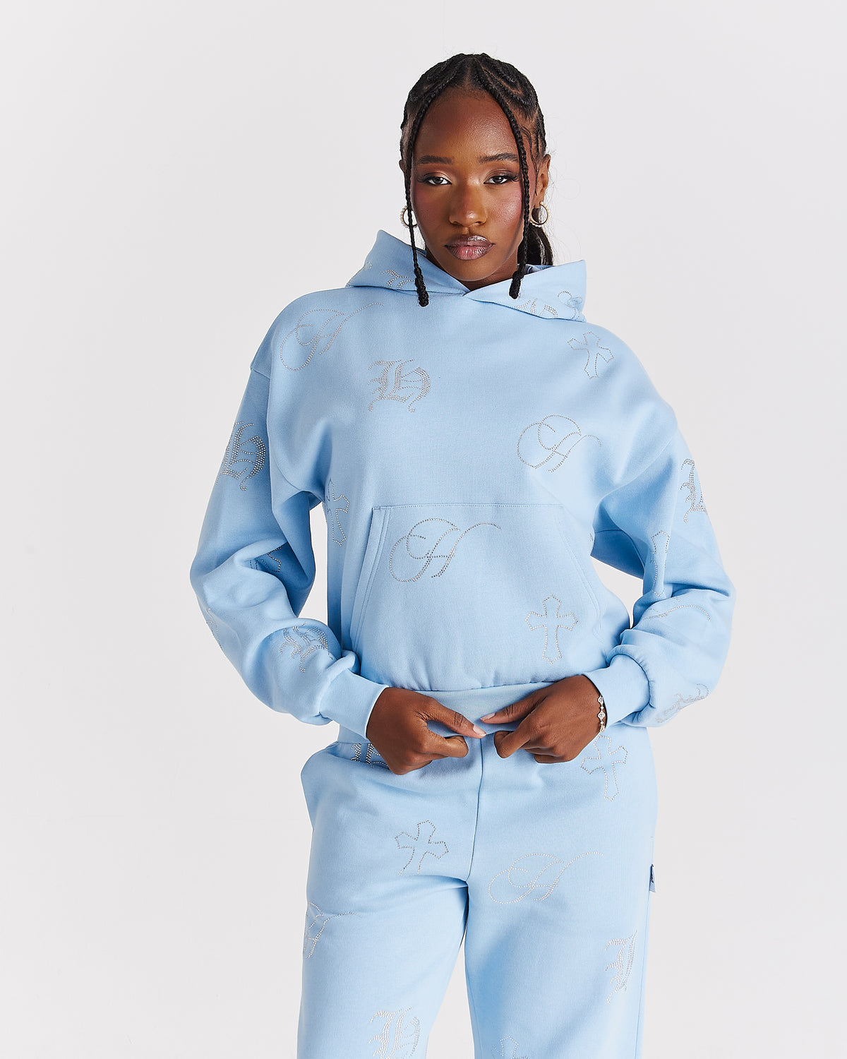 Displays a model wearing the blue 'Hoodrich' branded women's Crystal Full Tracksuit