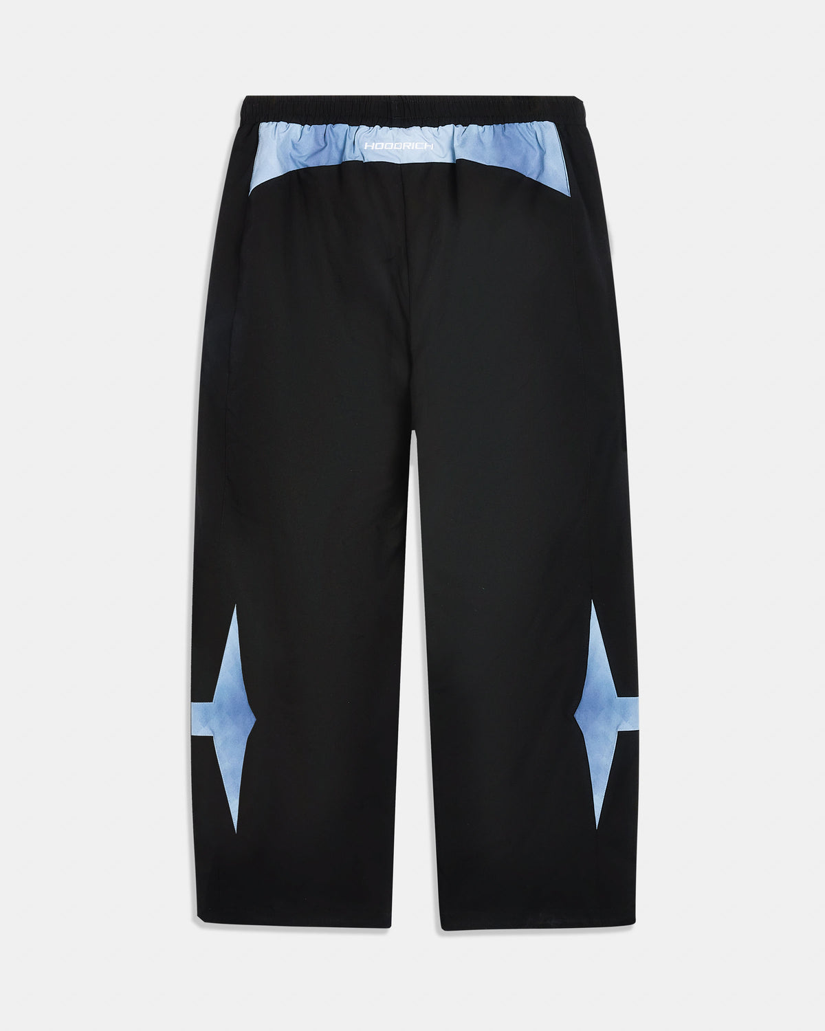 Black pants with a light blue abstract patterned waistband and large light blue starburst accents on the lower legs, shown flat against a light gray background.