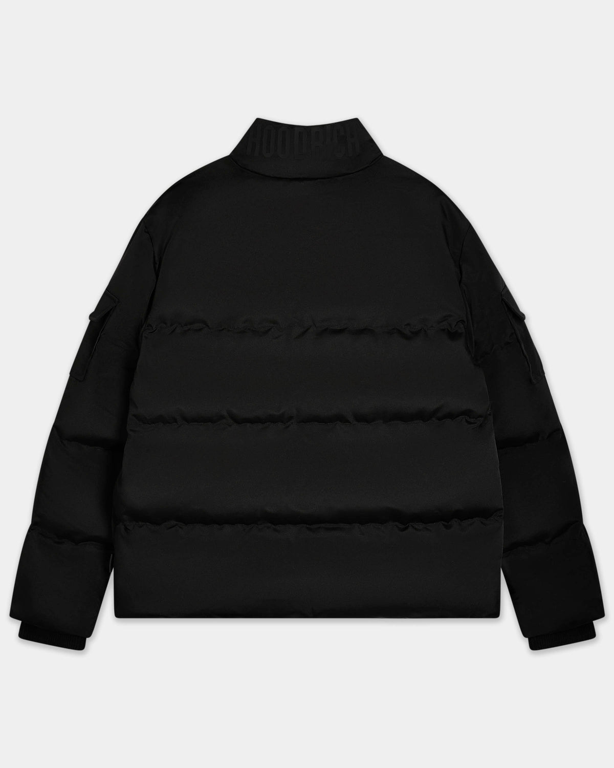 A black puffer jacket with horizontal quilting and a mock neck collar, shown from the back against a light gray background.