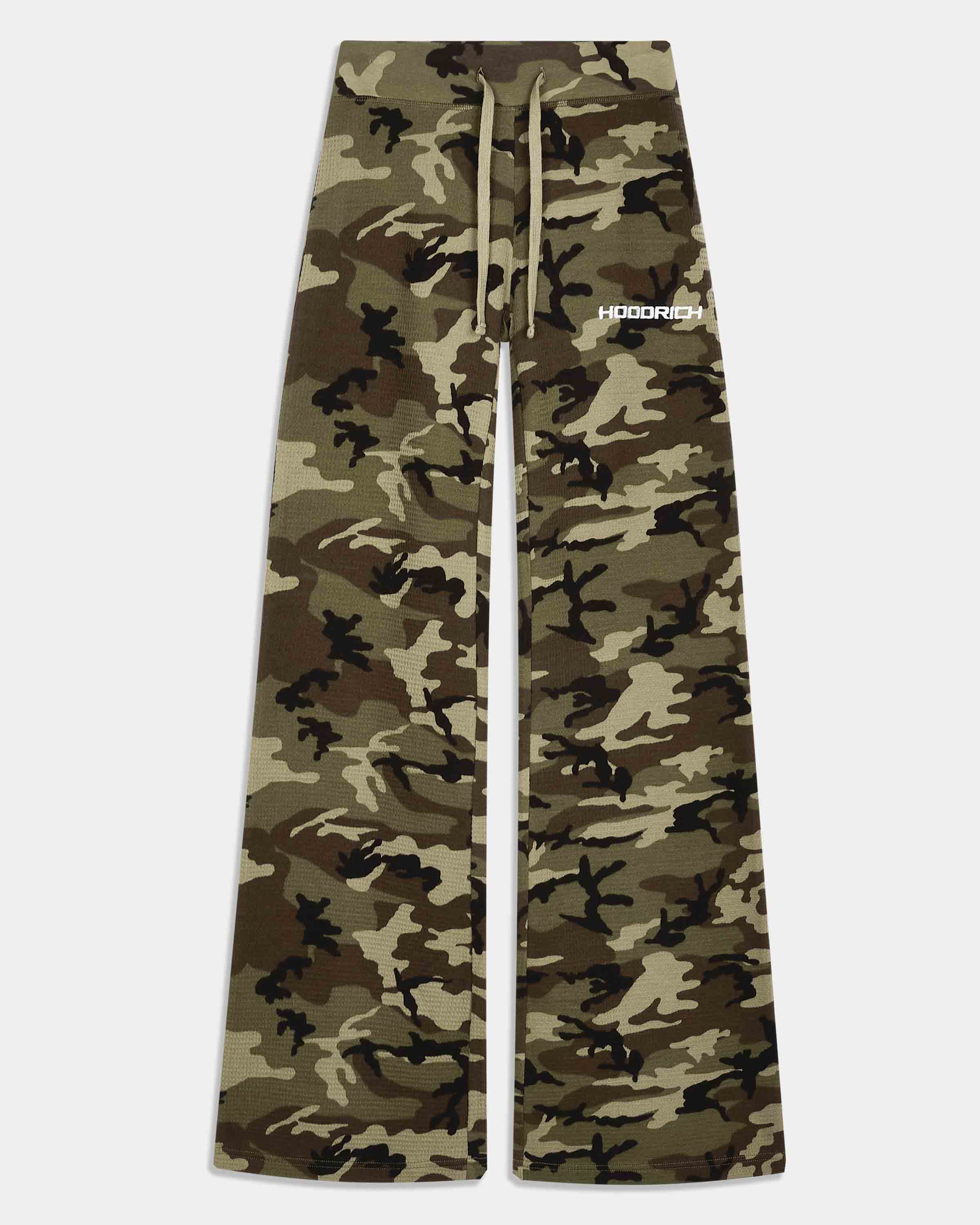 A pair of wide-leg sweatpants in a classic camouflage pattern, featuring a drawstring waist and a small white 'HOODRICH' logo on the upper right leg, displayed flat against a light gray background.